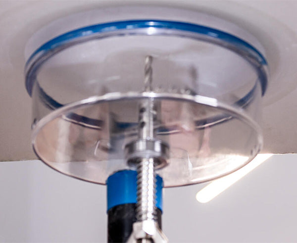 Adjustable Round Hole Cutter w/ Vacuum Port, 9" - In use on ceiling - Primus Cable