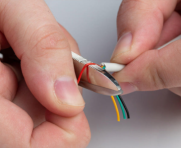 Electrician's Scissors - Using back of shears to strip wire - Primus Cable