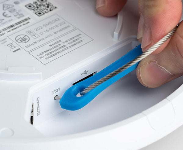 Ubiquiti® Wifi Access Point Unlock & Reset Tool - In use on a reset button - Primus Cable